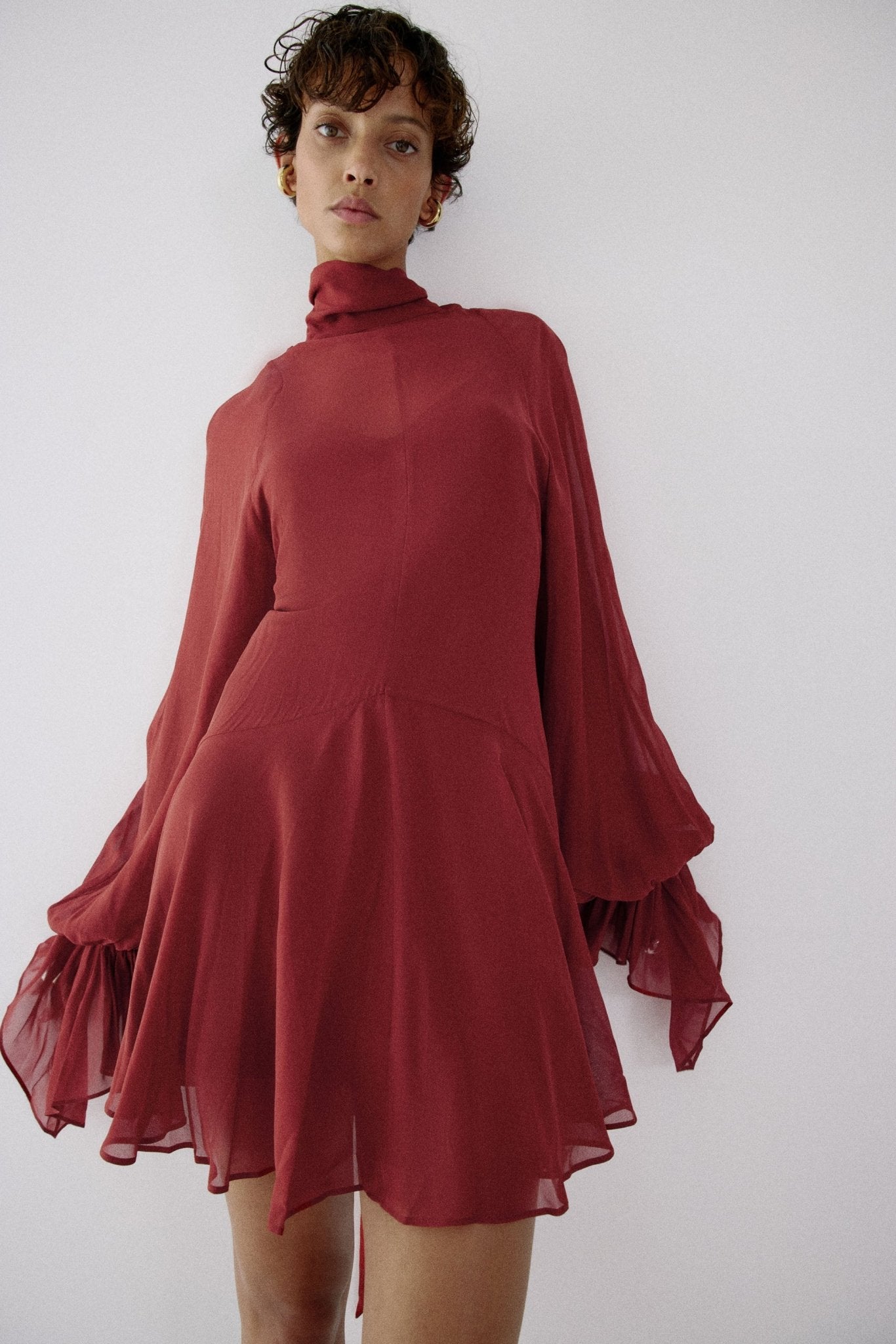 red short dress with sleeves Scarlet Dress Teuta Matoshi Light weight cotton material Full polyester lining Plunge neckline Puffed sleeves Pockets Mini length Elastic stretch waist Pull on design Red Short Sleeve Dress -